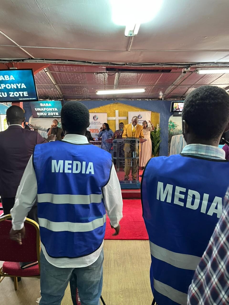 Media team filming a church service